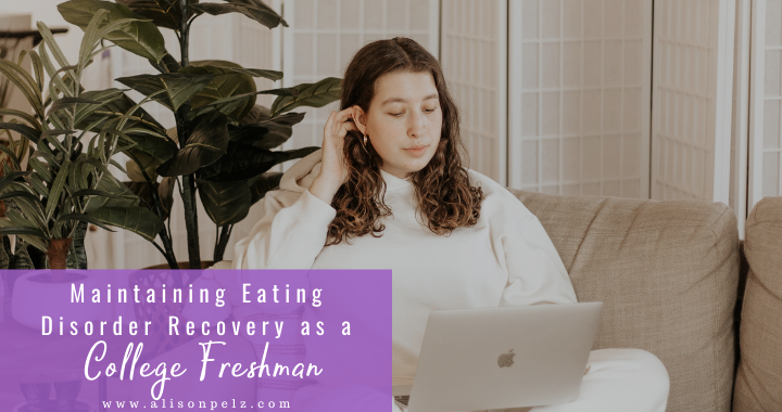 Recovery; White text over a purple background in the bottom left corner that reads "Maintaining Eating Disorder Recovery as a College Freshman". The rest of the image is a photo of a young woman sitting on a couch with a laptop in her lap.